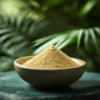 Wooden bowl with Tongkat Ali 100:1 extract in powder form on a stone surface